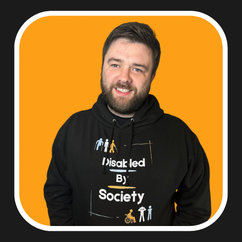 Jamie smiling ear to ear in his disabled by society hoodie 