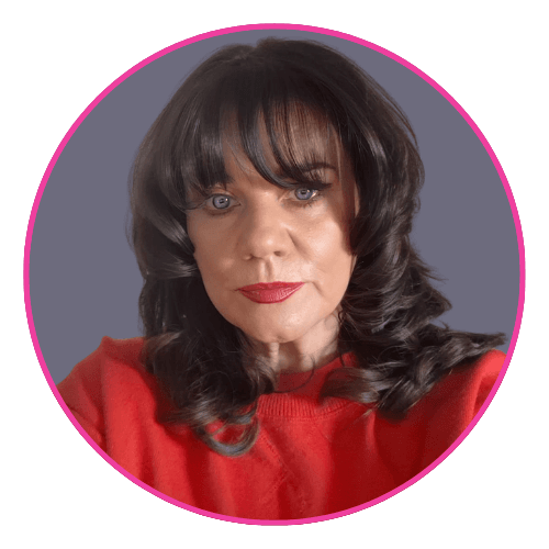 Tanya wearing a red top, with shoulder-length curly dark hair and bangs.