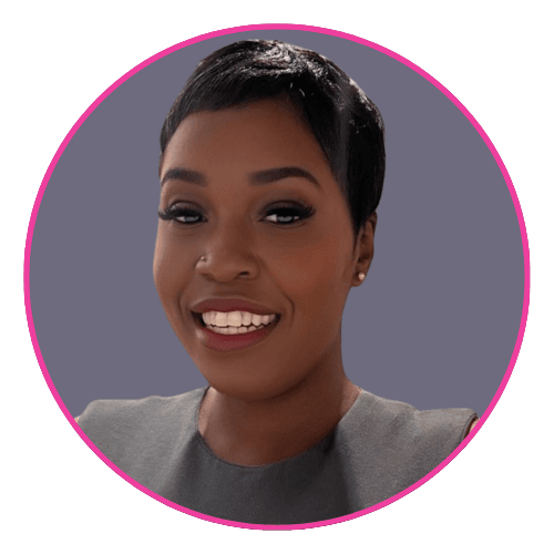 Terri Louise smiling against a muted purple background, wearing a sleeveless grey top and stud earring.