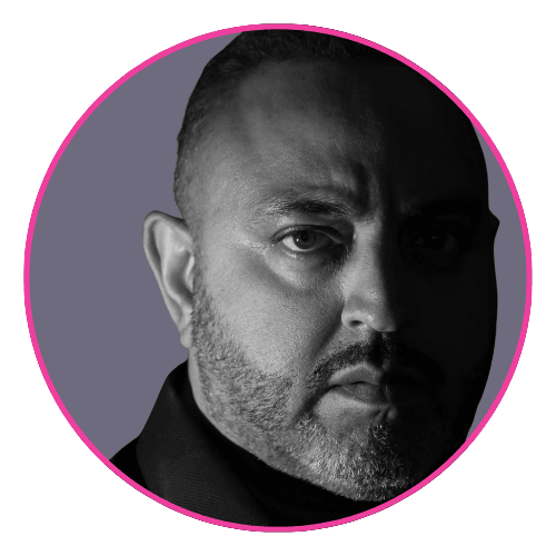 Dr Amo Raju in black and white portrait, framed by a pink circle, set against a muted purple background.