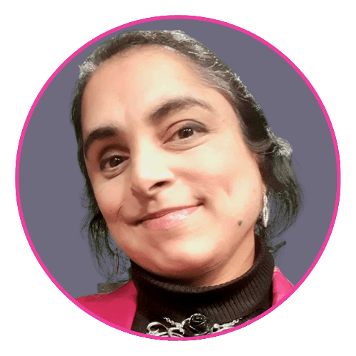 Avril smiling slightly against a purple background, wearing a black turtleneck and pink jacket.