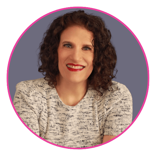 Meryl smiling against a muted purple background, wearing a white and black textured top with red lipstick.