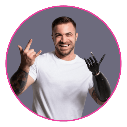 Chris smiling and gesturing with a prosthetic arm, wearing a white t-shirt and showing tattoos on his natural arm.